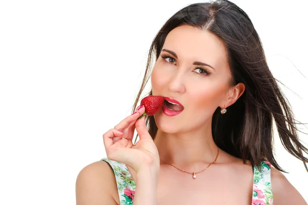 Girl with strawberry in hand isolated on white — Stock Photo, Image