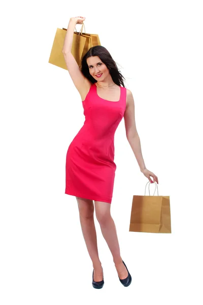 Imagem de mulher linda em vestido vermelho com compras biodegradáveis — Fotografia de Stock