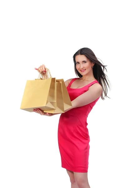 Bild einer schönen Frau im roten Kleid mit biologisch abbaubarem Einkauf — Stockfoto