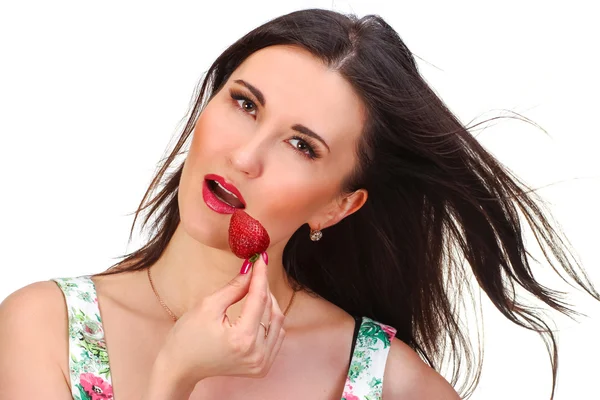 Pretty woman with strawberry in hand isolated on white — Stock Photo, Image