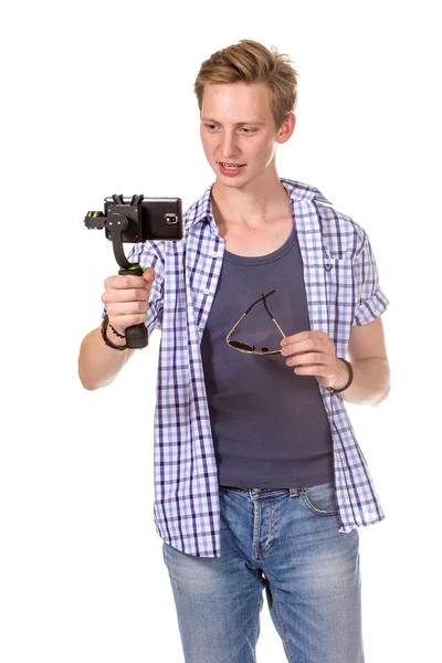 L'uomo tiene piccola action camera . — Foto Stock