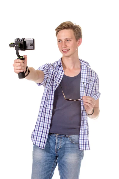 L'uomo tiene piccola action camera . — Foto Stock