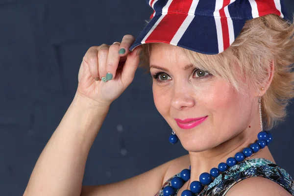 Adult woman in union jack cap — Stock Photo, Image