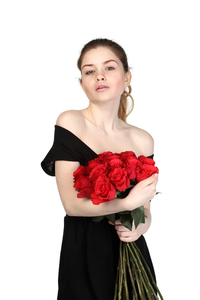 Beautiful brunette with a bouquet of roses — Stock Photo, Image