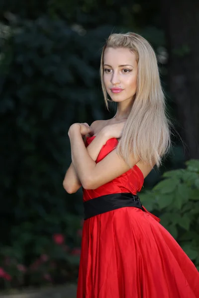 Lady in red outdoors — Stock Photo, Image