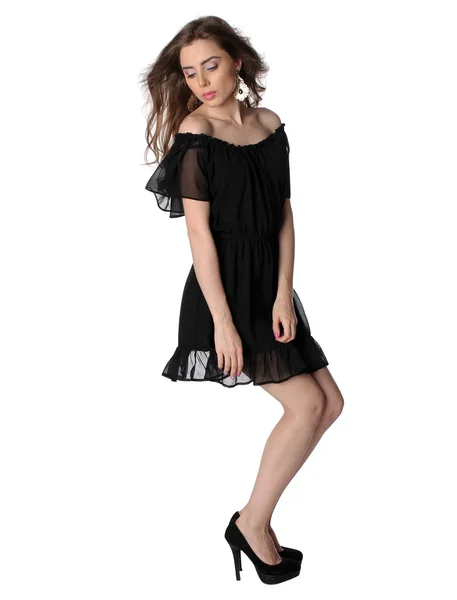 Menina atraente em um pequeno vestido preto isolado — Fotografia de Stock