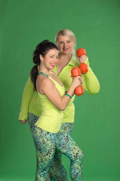 Equipo de mujeres bombeando músculos —  Fotos de Stock