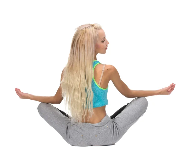 Portrait of young woman meditating in pose of lotus, back view — Stock Photo, Image