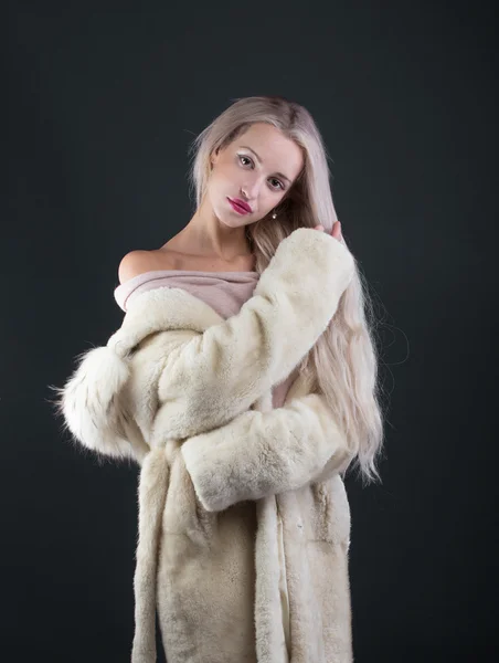 Young Woman Fashion Model dressed in white fur coat — Stock Photo, Image