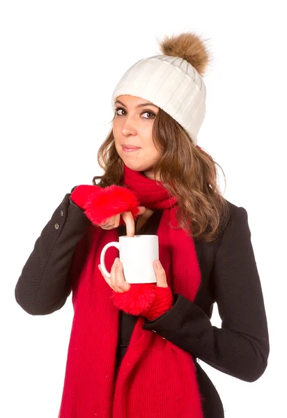来杯茶在圣诞老人的帽子的女孩 — 图库照片