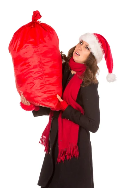 Sexy santa dívka s velkou taškou dárků na bílém pozadí — Stock fotografie