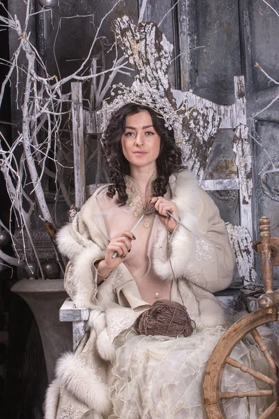 Woman in Russian traditional dress with knitting needles in her — Stock Photo, Image