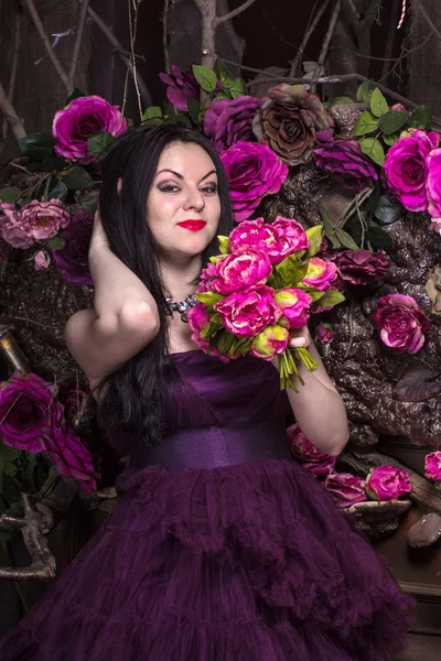 Oriental woman with flowers — Stock Photo, Image