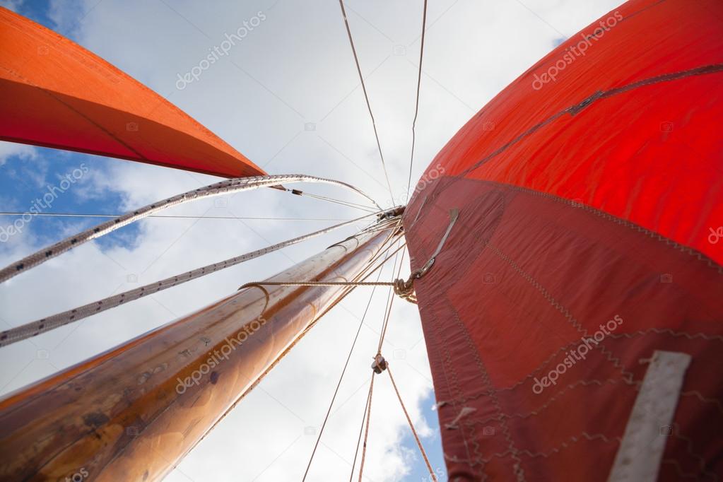 Wooden boat with sail