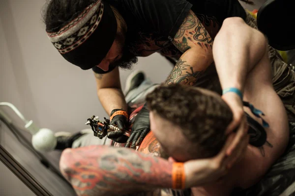 Tattoo artists at work — Stock Photo, Image