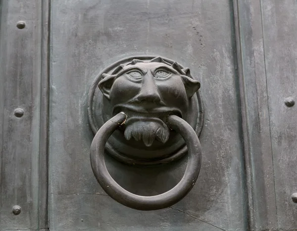 Ornate metal monster head door knocker — Stock Photo, Image