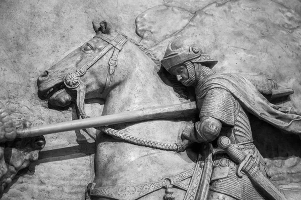 Bas-relief of knight with a spear striking dragon — Stock Photo, Image