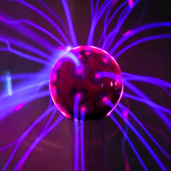 Plasma ball  with magenta-blue flames — Stock Photo, Image