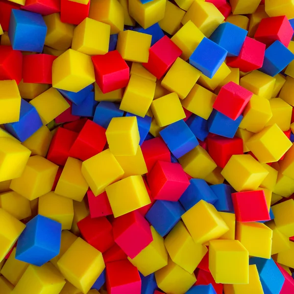 Colored foam rubber cubes background — Stock Photo, Image