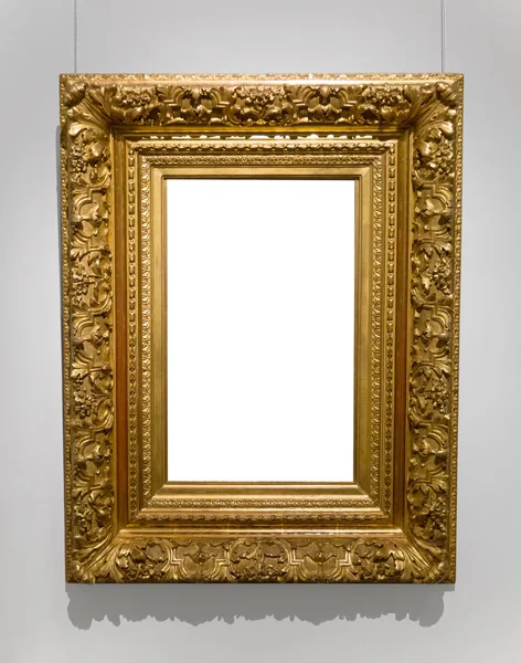 Gold empty frame on white wall — Stock Photo, Image