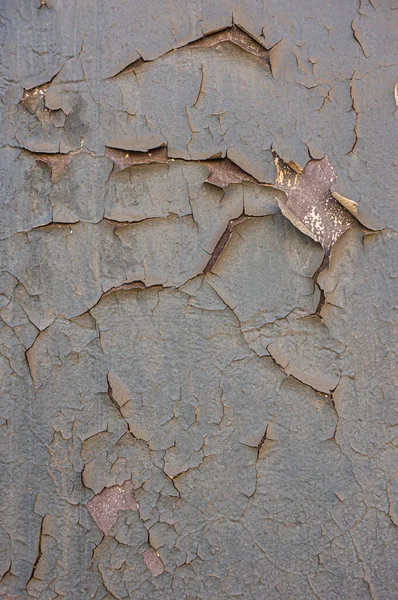Detalle de cerca de pintura agrietada en la pared. Pintura pelada en textura de pared. Patrón de material grunge azul rústico —  Fotos de Stock