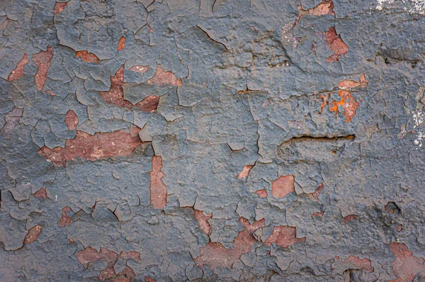 壁に亀裂塗料のクローズアップ詳細。壁の質感に塗装を剥離。素朴な青のグランジ素材のパターン — ストック写真