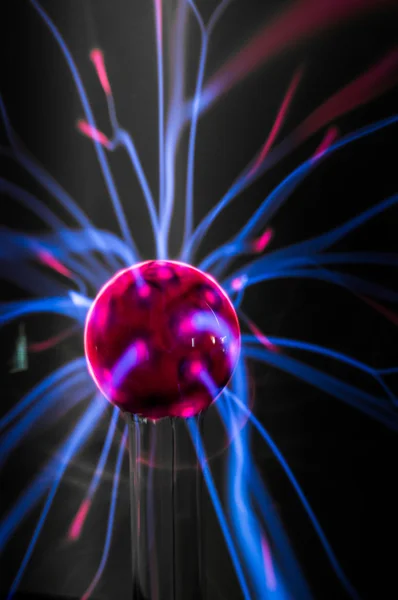 Plasma ball  with magenta-blue flames isolated on a black background. — Stock Photo, Image