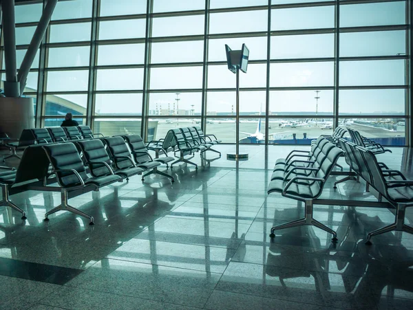 Airport waiting area , seats and outside the window scene — Stock Photo, Image