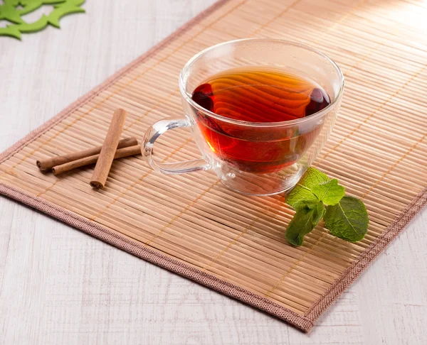 Cup of tea with cinnamon and mint — Stock Photo, Image