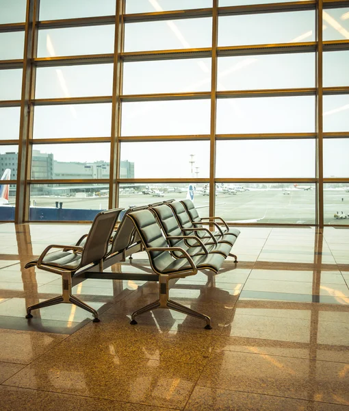 Airport waiting area , seats and outside the window scene — Stock Photo, Image