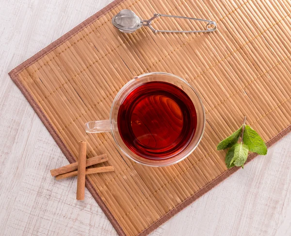Cup of tea with cinnamon and mint — Stock Photo, Image