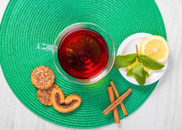 Cup of tea with mint, cinnamon and lemon — Stock Photo, Image