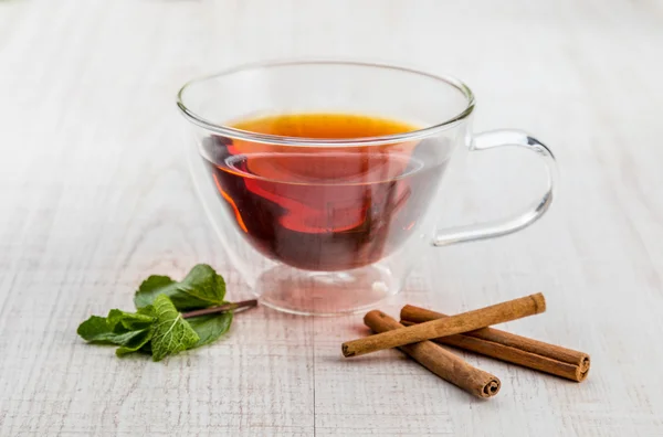 Cup of tea with mint and cinnamon — Stock Photo, Image