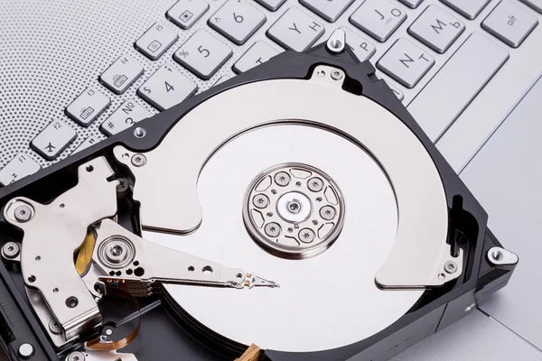 Hard disk HDD over laptop keyboard — Stock Photo, Image
