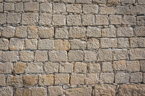 Superficie del muro di pietra reale incrinato decorativo con cemento — Foto Stock