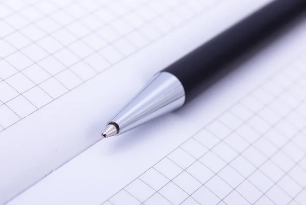 Close-up of ball point pen over paper — Stock Photo, Image