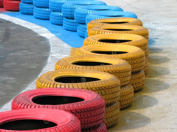 Racetrack fence of old tires — Stock Photo, Image