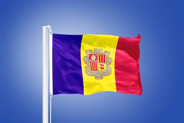 Flag of Andorra flying against a blue sky — Stock Photo, Image