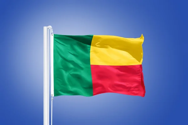 Flag of Benin flying against a blue sky — Stock Photo, Image