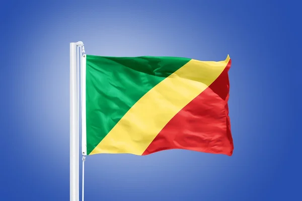 Vlajka republiky Kongo létal proti modré obloze — Stock fotografie