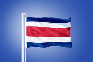 Flag of Costa Rica flying against a blue sky clipart