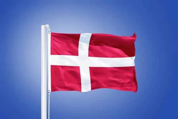 Flag of Denmark flying against a blue sky — Stock Photo, Image