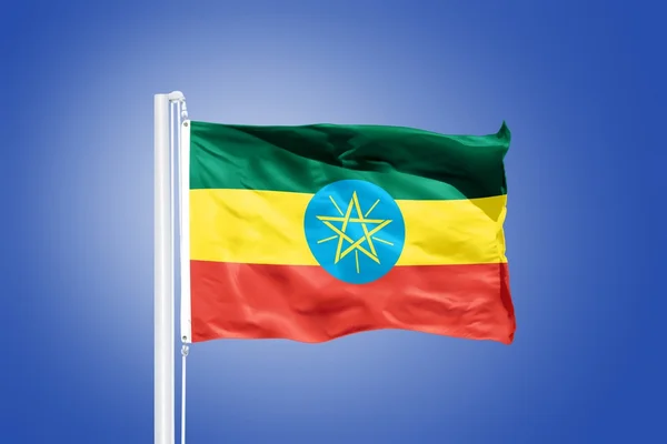 Flag of Ethiopia flying against a blue sky — Stock Photo, Image