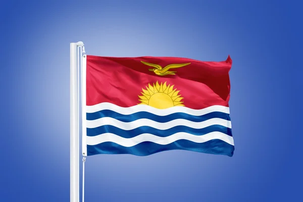Flag of Kiribati flying against a blue sky — Stock Photo, Image