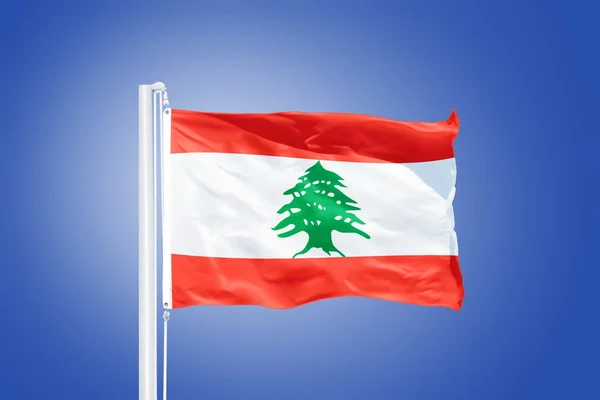 Flag of Lebanon flying against a blue sky — Stock Photo, Image