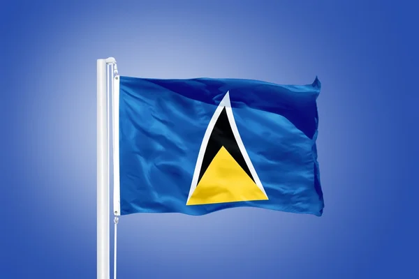 Vlag van Saint Lucia vliegen tegen een blauwe hemel — Stockfoto