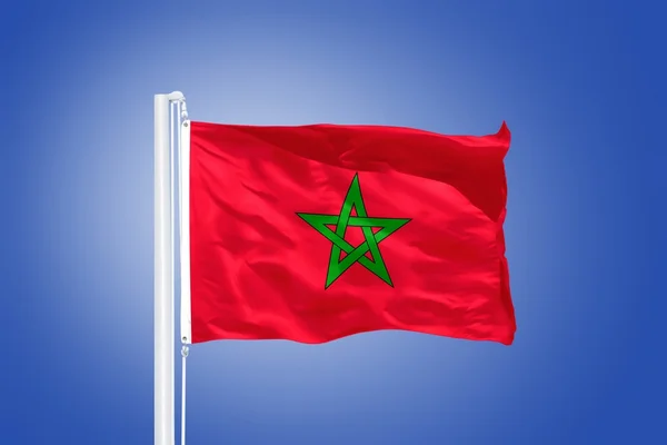 Flag of Morocco flying against a blue sky — Stock Photo, Image