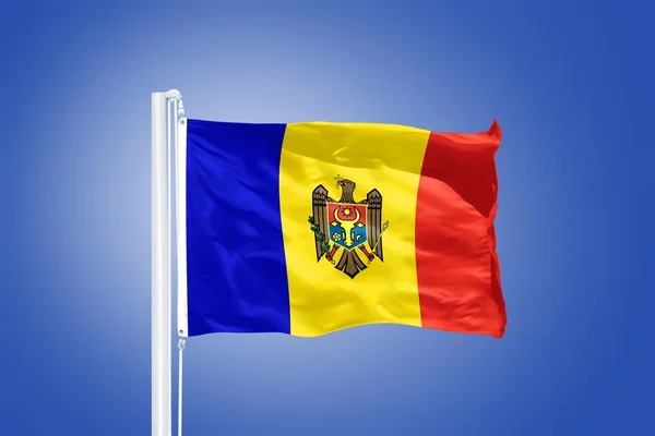 Flag of Moldova flying against a blue sky — Stock Photo, Image