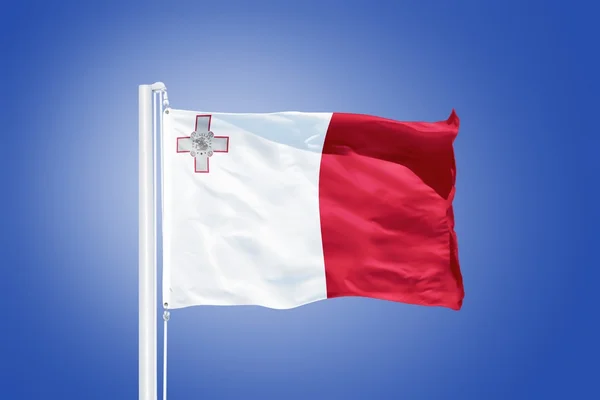 Flag of Malta flying against a blue sky — Stock Photo, Image