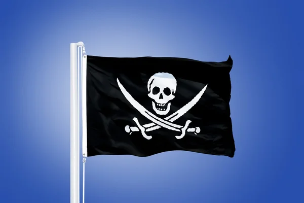 Piraat van de Jolly Roger vlag waait in de wind — Stockfoto